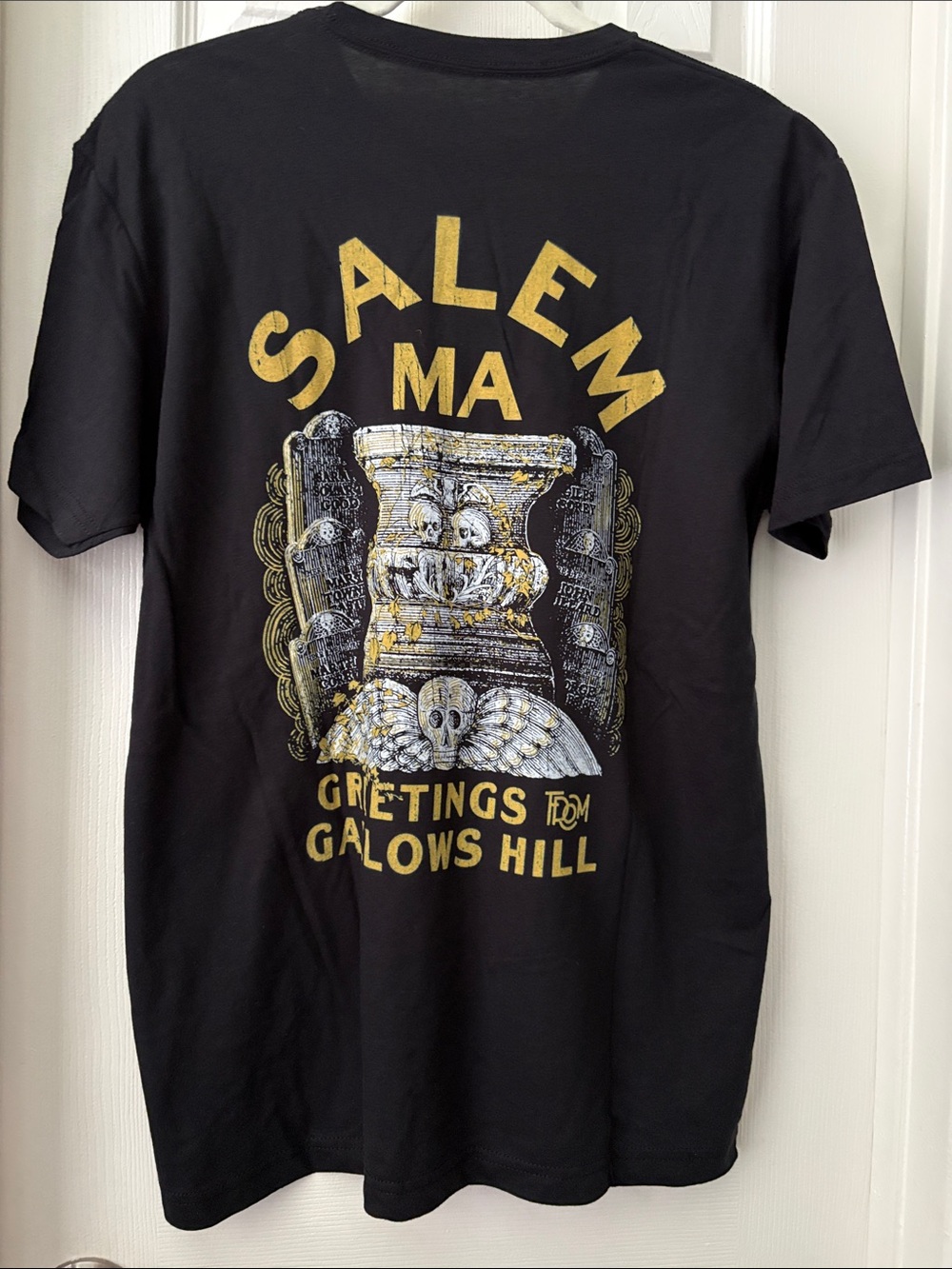1776 United Salem MA Gallows Hill Graphic Tee - Black and Gold Halloween L